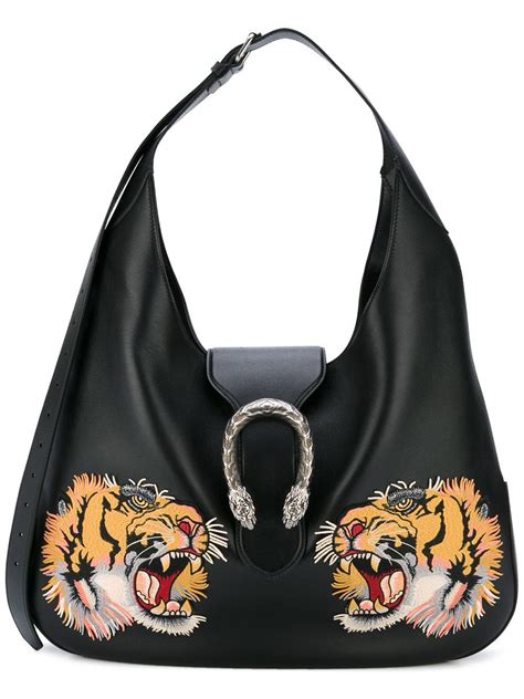 gucci bag with tiger head.